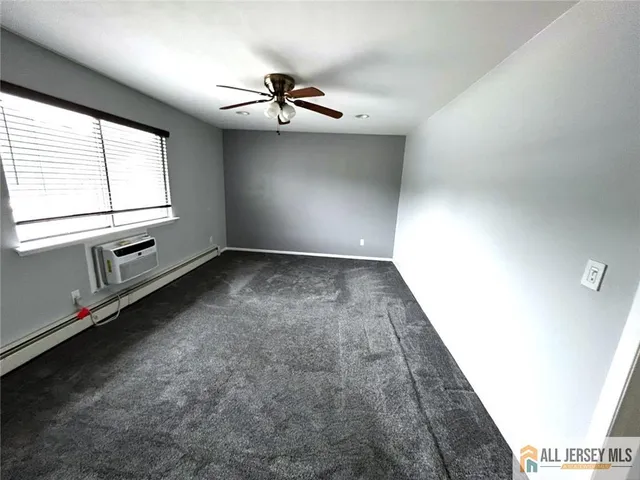 a view of an empty room with windows