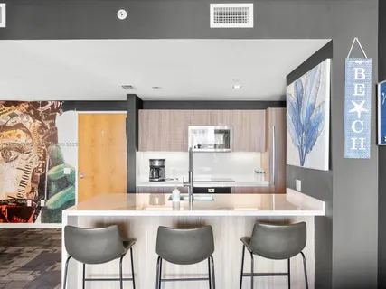 a kitchen with furniture and window