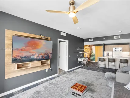 a living room with furniture and a large window