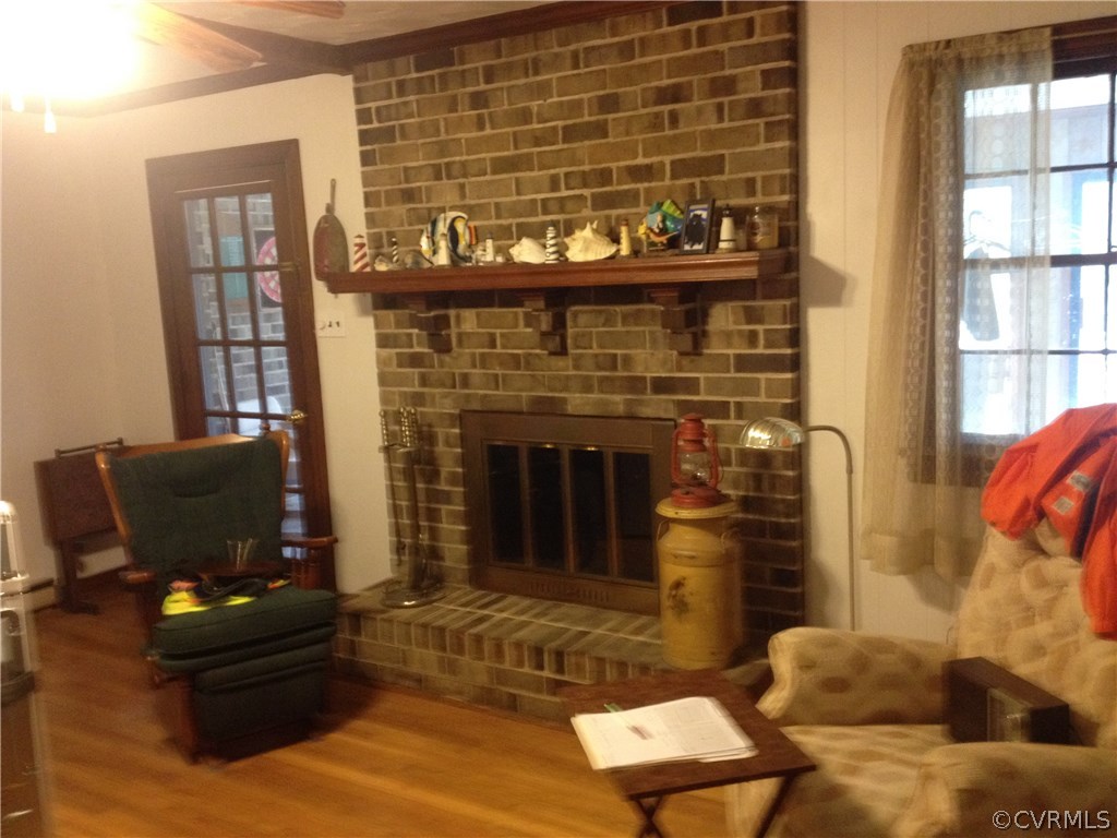 7750 Varann Road Henrico, VA 23231 - Photo 3 of 10 a living room with furniture and a fireplace