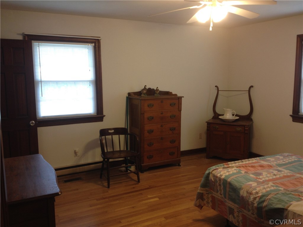 7750 Varann Road Henrico, VA 23231 - Photo 7 of 10 a bedroom with a bed and a dresser