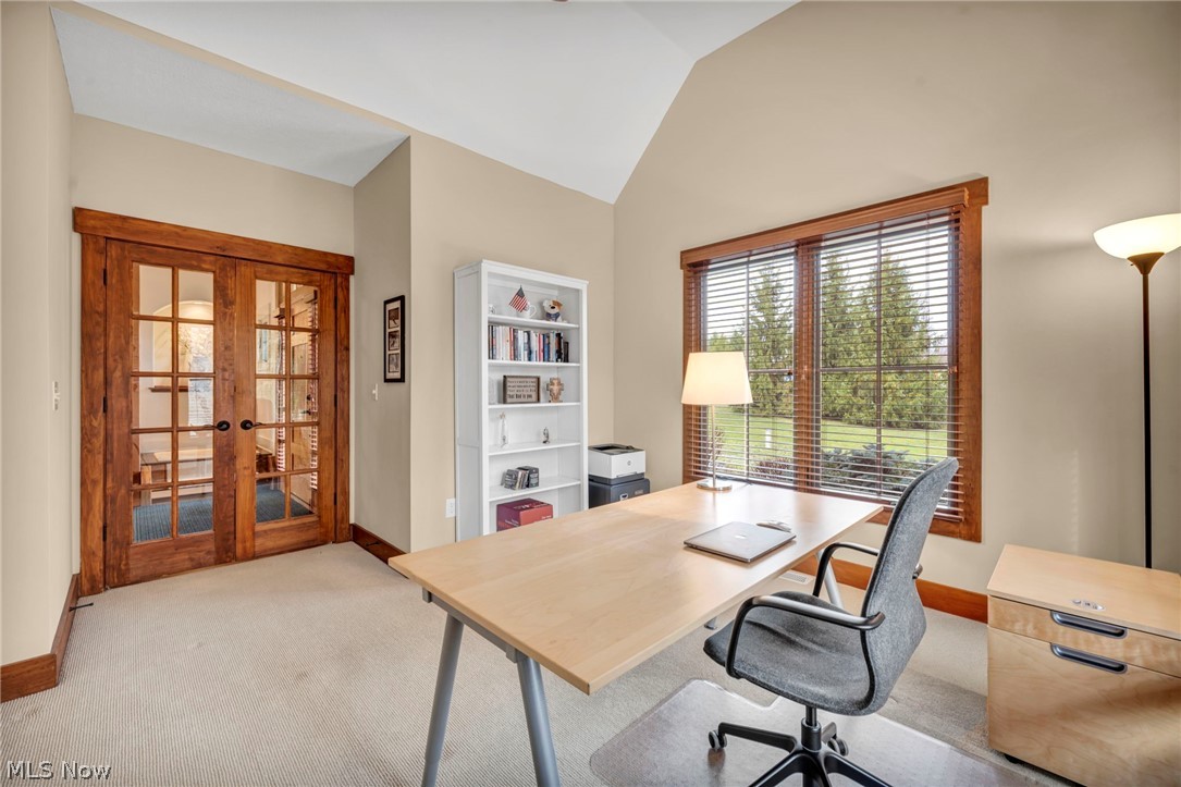 11295 Sutton Place Chardon, OH 44024 - Photo 18 of 50 Home office with french doors, light carpet, and vaulted ceiling