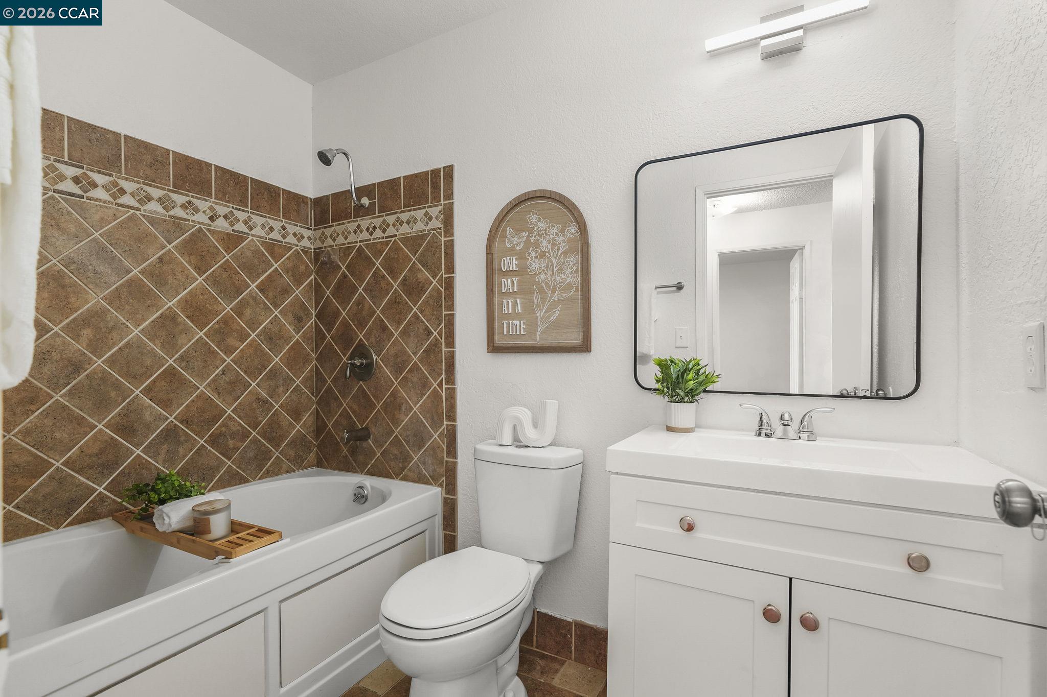 476 Pamela Drive Bay Point, CA 94565 - Photo 6 of 24 a bathroom with a toilet a sink and a mirror