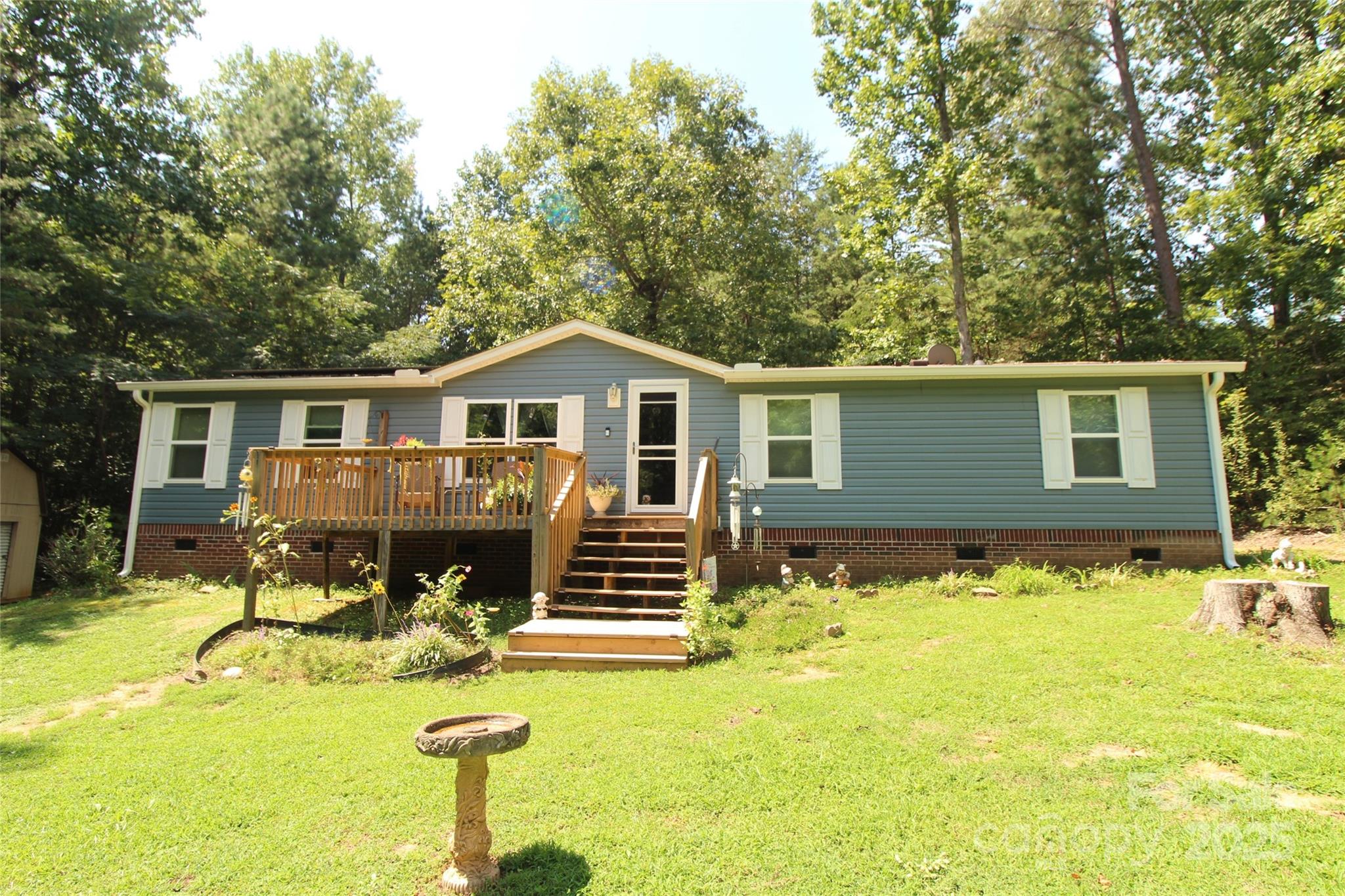 7035 Twin Streams Lane Clover, SC 29710 - Photo 1 of 22 a front view of house with yard porch and furniture
