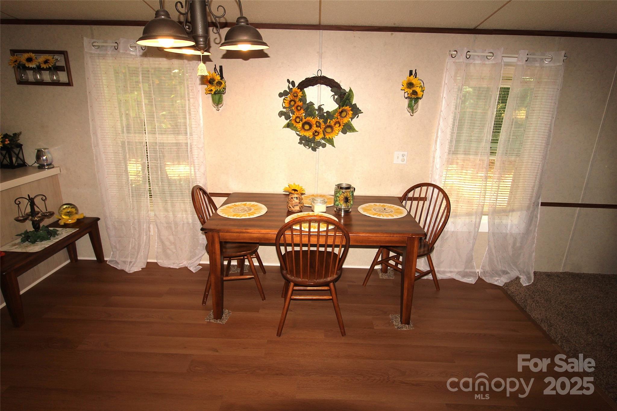 7035 Twin Streams Lane Clover, SC 29710 - Photo 11 of 22 a view of a dining room with furniture and wooden floor