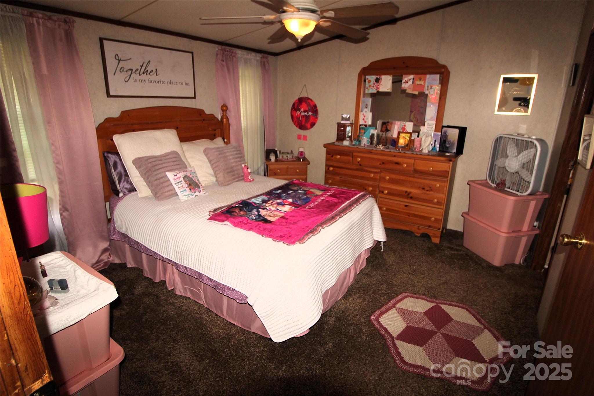 7035 Twin Streams Lane Clover, SC 29710 - Photo 13 of 22 a bedroom with a bed and a chandelier