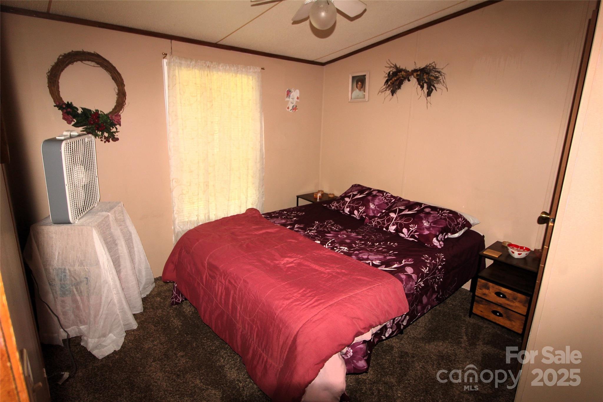 7035 Twin Streams Lane Clover, SC 29710 - Photo 19 of 22 a bedroom with a bed and a dresser