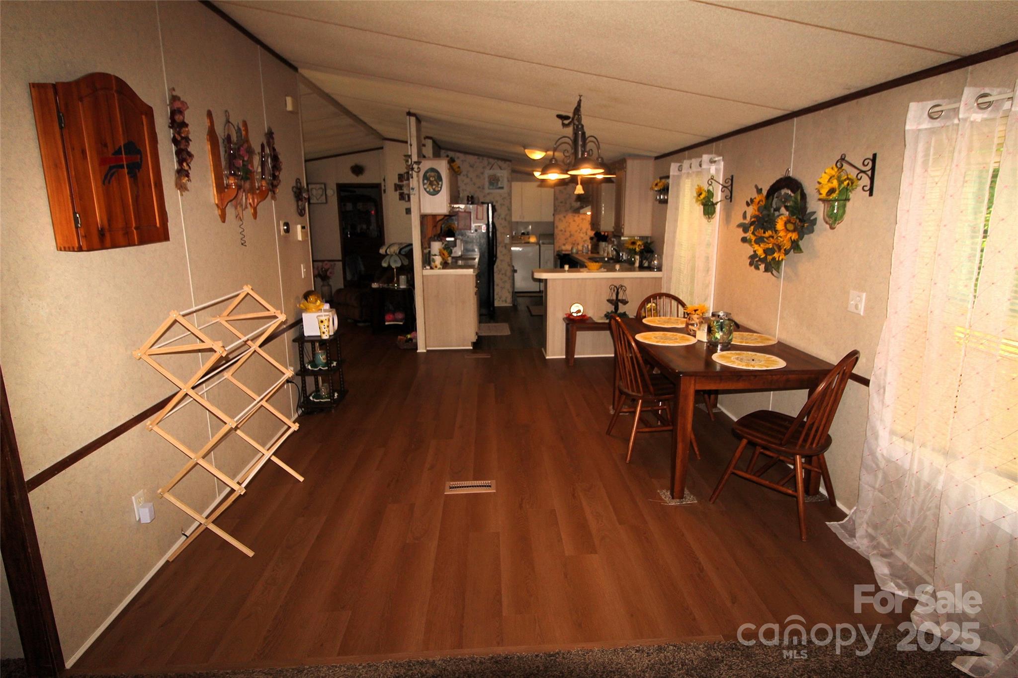 7035 Twin Streams Lane Clover, SC 29710 - Photo 10 of 22 a view of a dining room with furniture and wooden floor