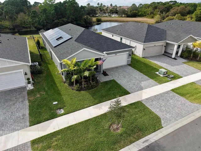 an aerial view of a house with a garden