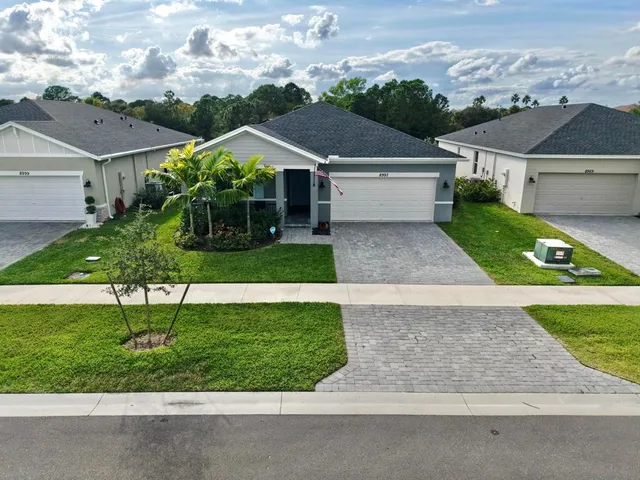 a view of house with garden space and street view
