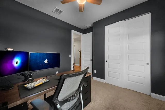 an empty room with closet area