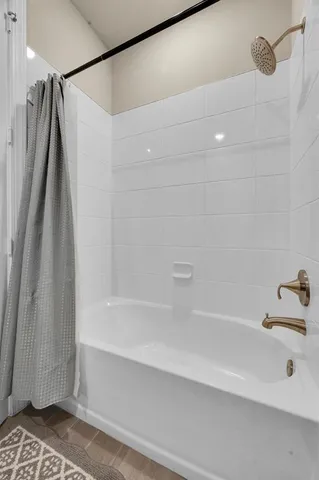 a kitchen with stainless steel appliances a sink a stove a refrigerator cabinets and a counter top space