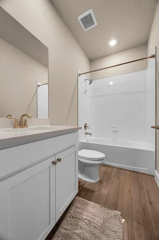 a kitchen with cabinets and chairs