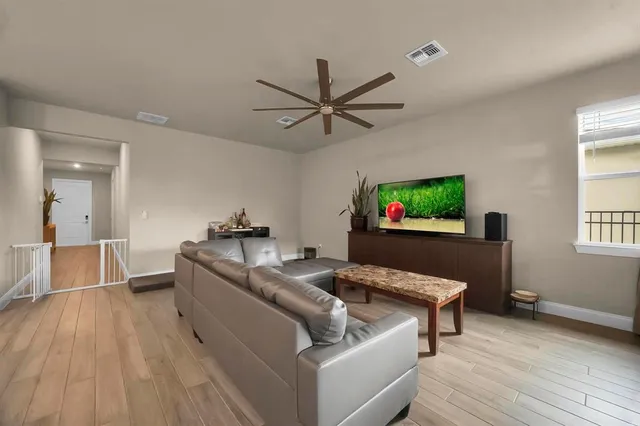 a view of walk in closet with clothes