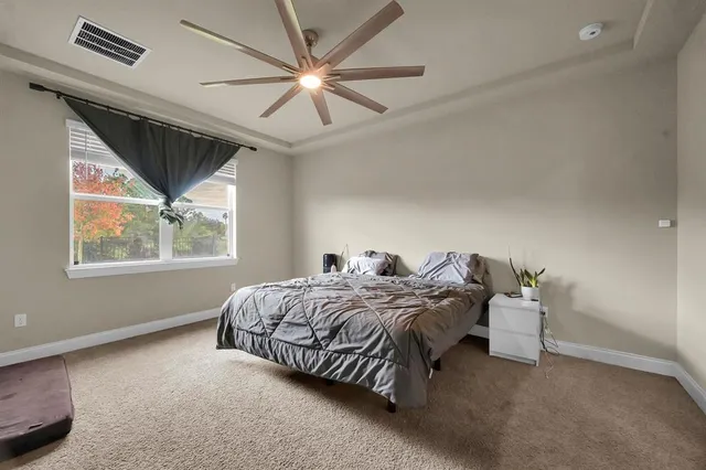 a white toilet sitting next to a white sink