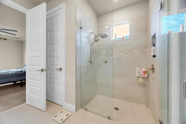 a bedroom with a bed and a flat tv screen