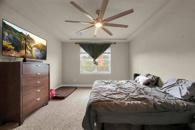 a view of hallway with wooden floor