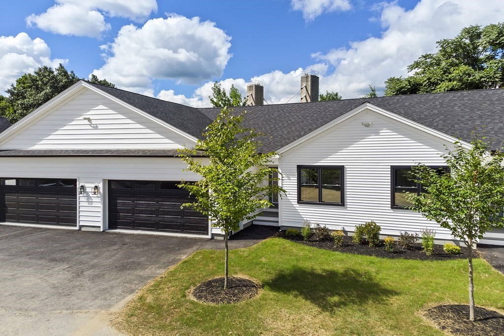 139 Harvard Street, Unit 10 Fitchburg, MA 01420 - Photo 1 of 11 a front view of a house with garden