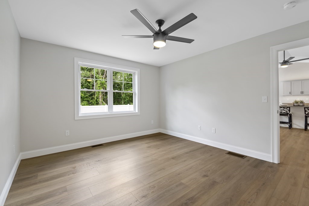 139 Harvard Street, Unit 10 Fitchburg, MA 01420 - Photo 11 of 11 wooden floor in an empty room with a window