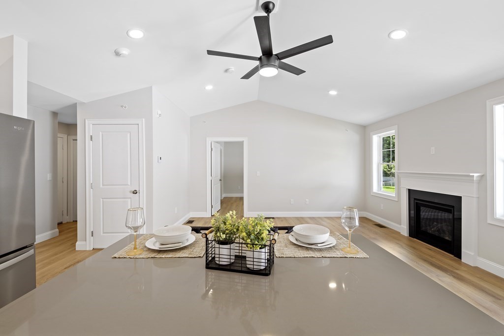 139 Harvard Street, Unit 10 Fitchburg, MA 01420 - Photo 4 of 11 a living room with furniture and a fireplace
