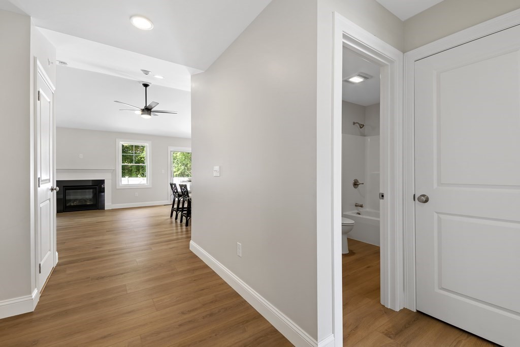 139 Harvard Street, Unit 10 Fitchburg, MA 01420 - Photo 6 of 11 a view interior of the house and livingroom with wooden floor