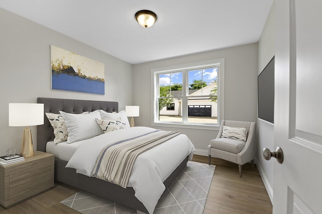 139 Harvard Street, Unit 10 Fitchburg, MA 01420 - Photo 7 of 11 a bedroom with a bed and a couch