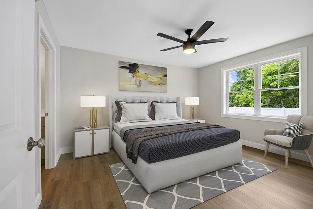 139 Harvard Street, Unit 10 Fitchburg, MA 01420 - Photo 10 of 11 a bedroom with a bed and a large window