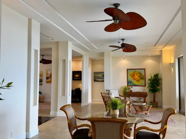 a dining room with furniture and window