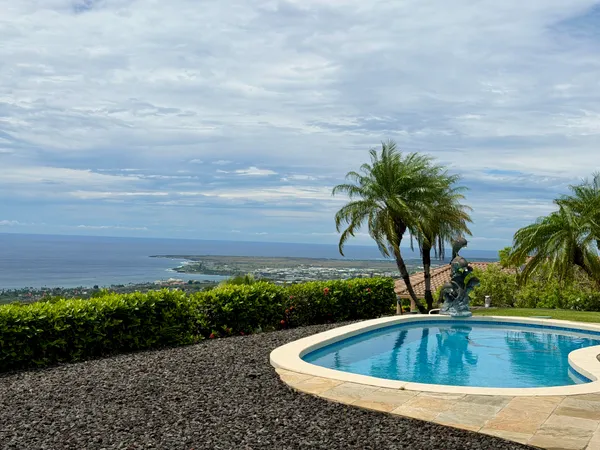 a view of swimming pool with a yard