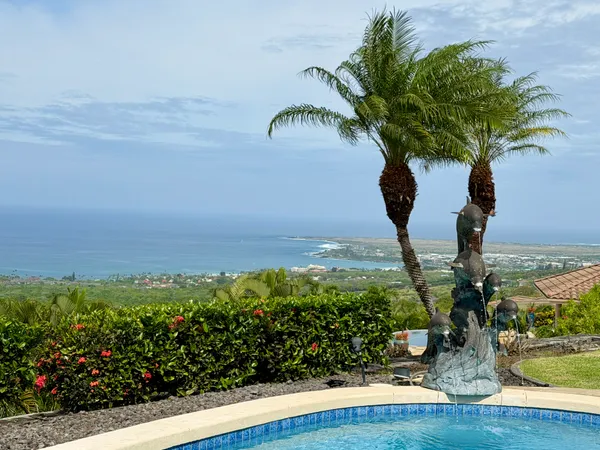 a vase of flowers sitting on a table with floor