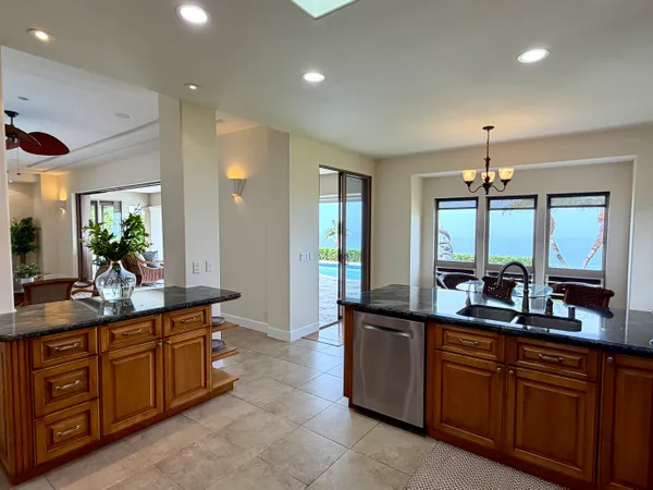 a large kitchen with lots of counter space and a sink