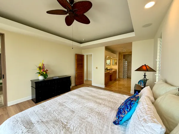 a bed room with a bed and a chandelier