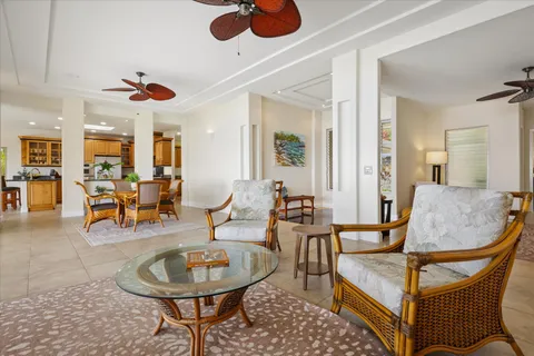 a living room with furniture a dining table and chairs