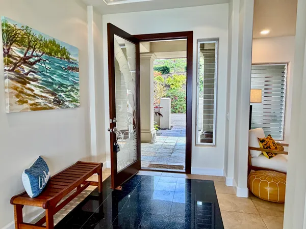 a living room with furniture and a gate