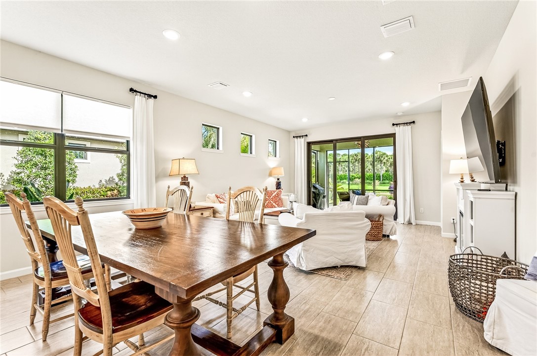 5191 Unity Square Vero Beach, FL 32967 - Photo 13 of 36 a view of a dining room with furniture window and outside view