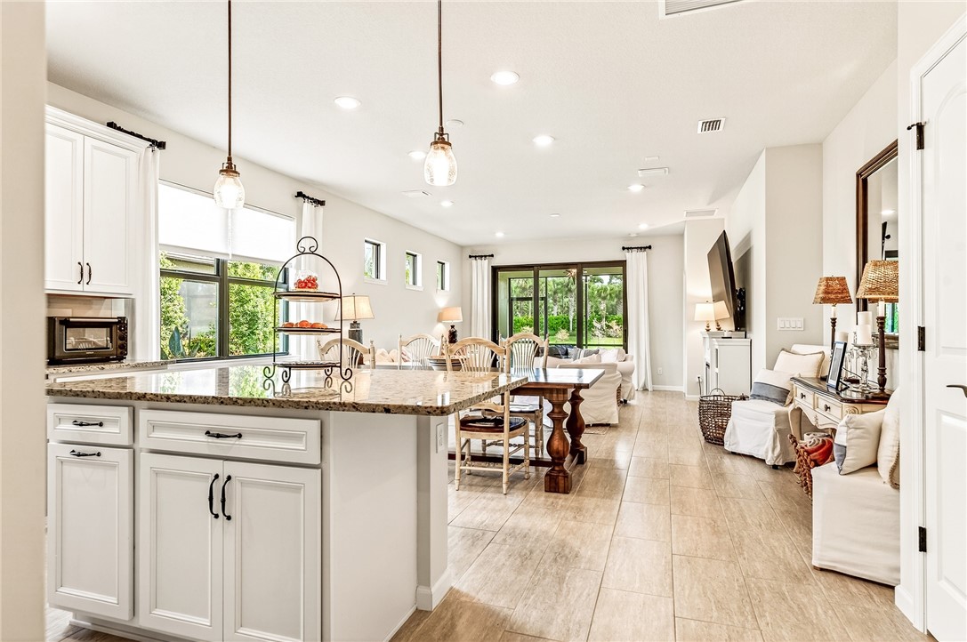 5191 Unity Square Vero Beach, FL 32967 - Photo 2 of 36 a open kitchen with stainless steel appliances granite countertop a stove and cabinets
