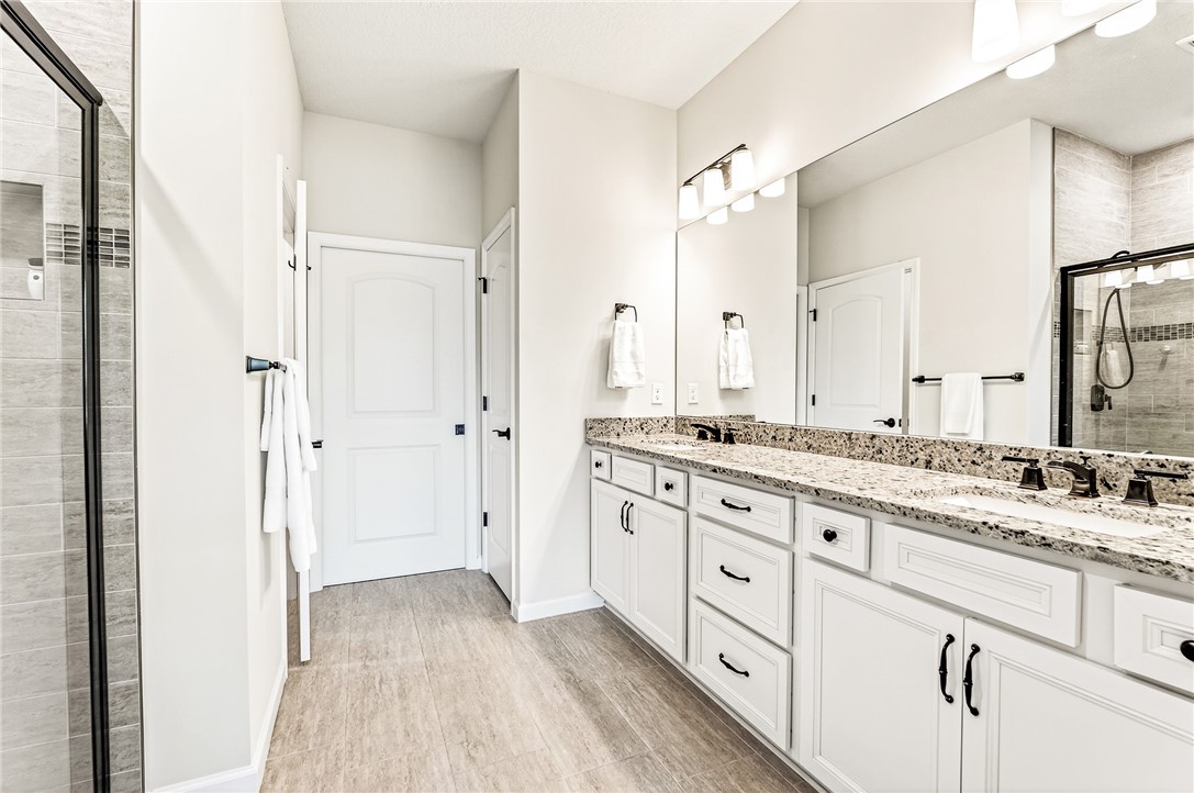5191 Unity Square Vero Beach, FL 32967 - Photo 21 of 36 a bathroom with a granite countertop double vanity sink mirror and
