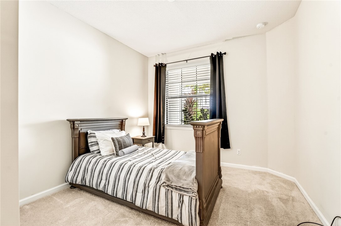 5191 Unity Square Vero Beach, FL 32967 - Photo 25 of 36 a bedroom with a bed and a window