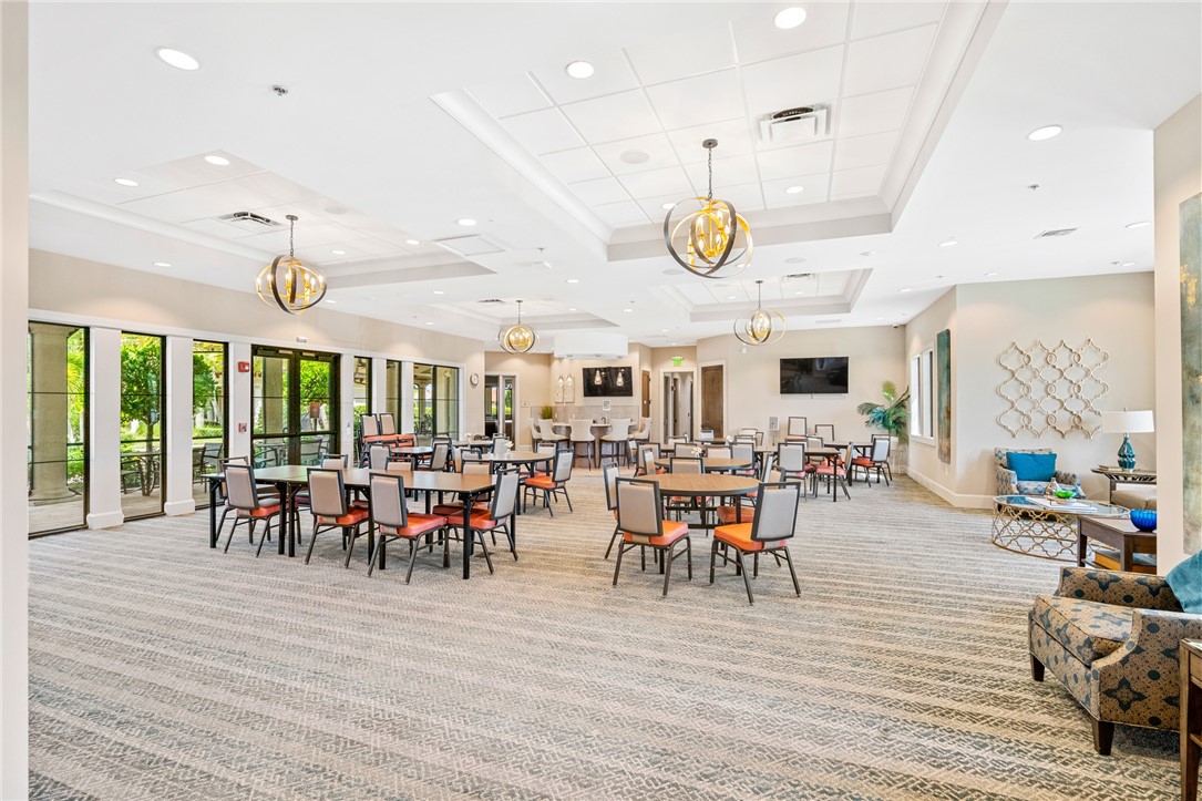 5191 Unity Square Vero Beach, FL 32967 - Photo 34 of 36 a view of a dining area with furniture window and wooden floor