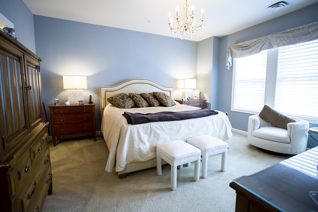 10 Abigail Way, Unit 3004 Reading, MA 01867 - Photo 11 of 32 a bedroom with a bed and a couch