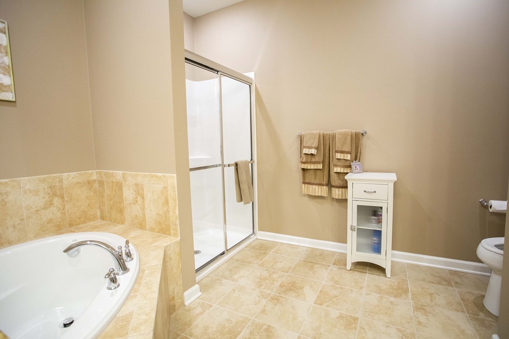 10 Abigail Way, Unit 3004 Reading, MA 01867 - Photo 14 of 32 a bathroom with a bathtub and a sink