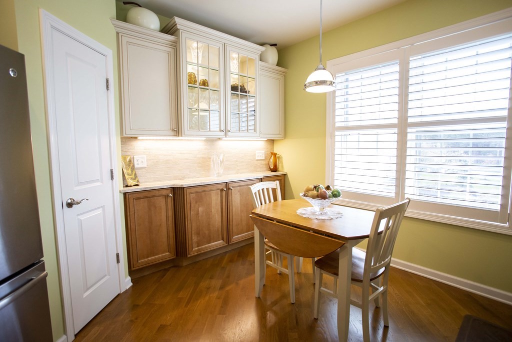 10 Abigail Way, Unit 3004 Reading, MA 01867 - Photo 19 of 32 a dining room with furniture and window