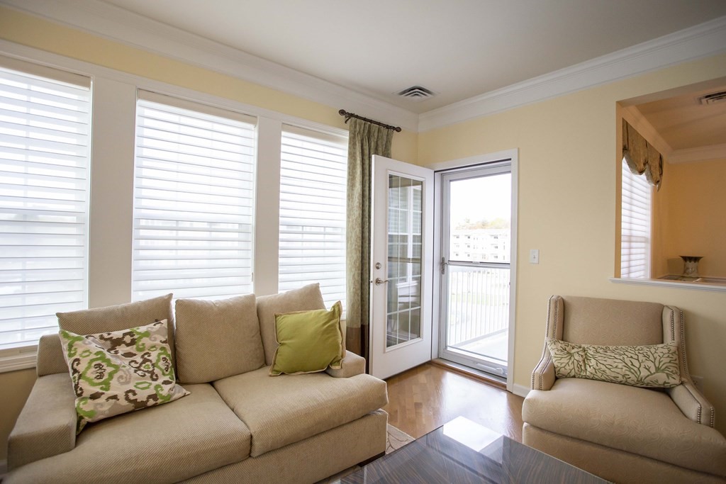 10 Abigail Way, Unit 3004 Reading, MA 01867 - Photo 24 of 32 a living room with furniture and windows