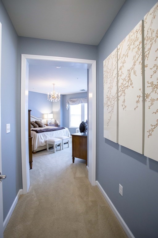 10 Abigail Way, Unit 3004 Reading, MA 01867 - Photo 9 of 32 a view of a livingroom with furniture and a window