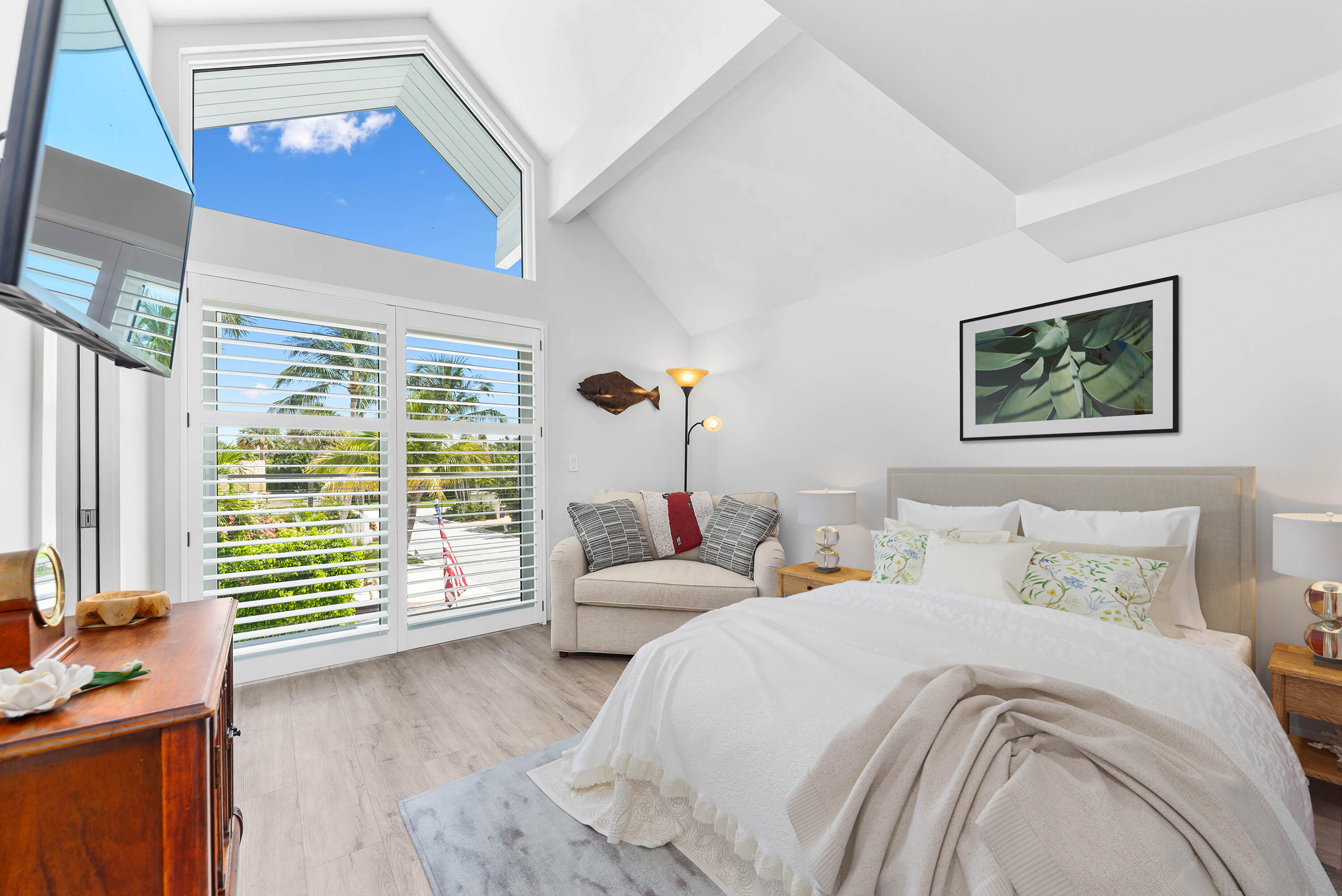 104 Sunfish Lane Jupiter, FL 33477 - Photo 26 of 66 a bedroom with a bed and a large window