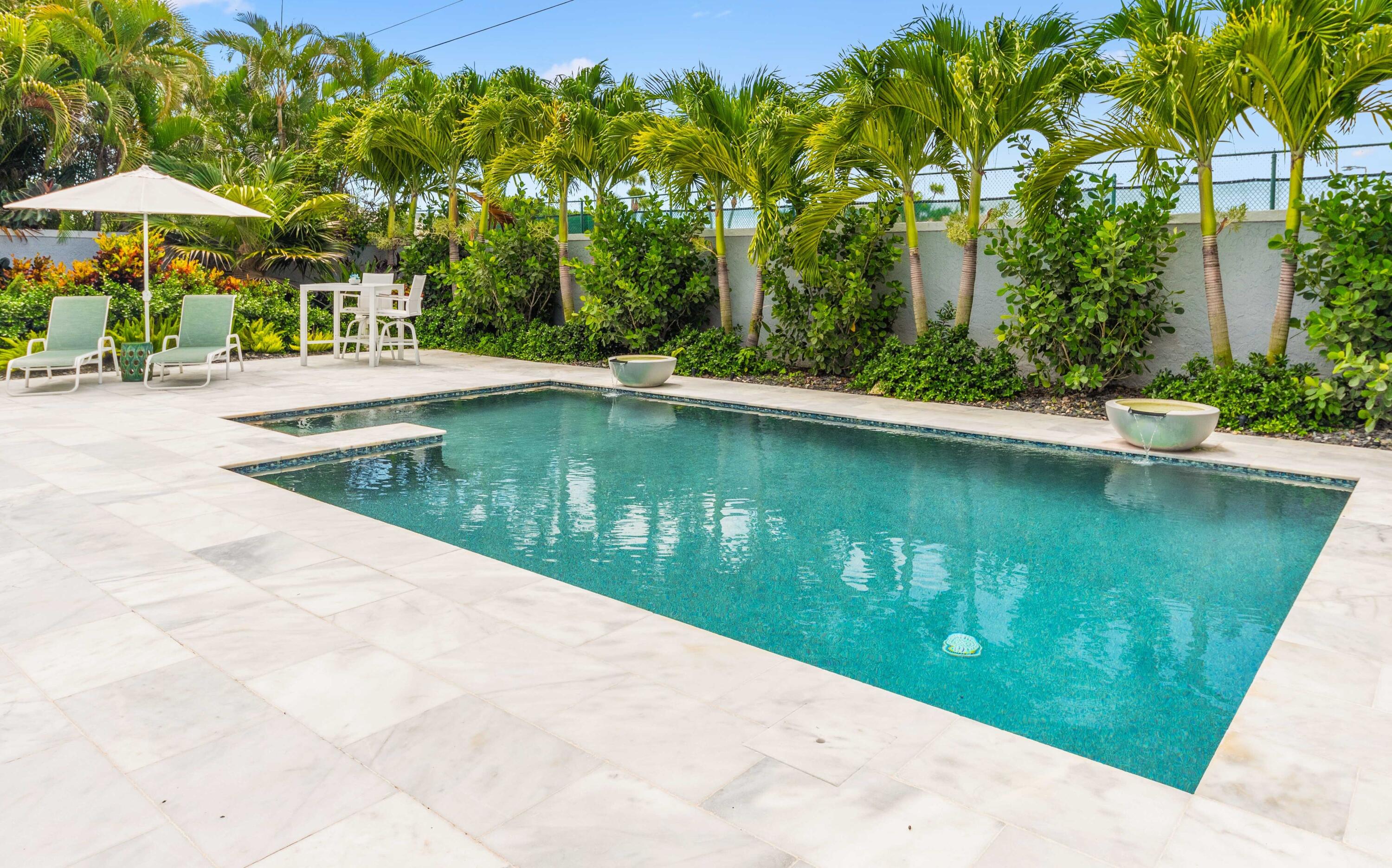 104 Sunfish Lane Jupiter, FL 33477 - Photo 29 of 66 a view of a swimming pool with a patio