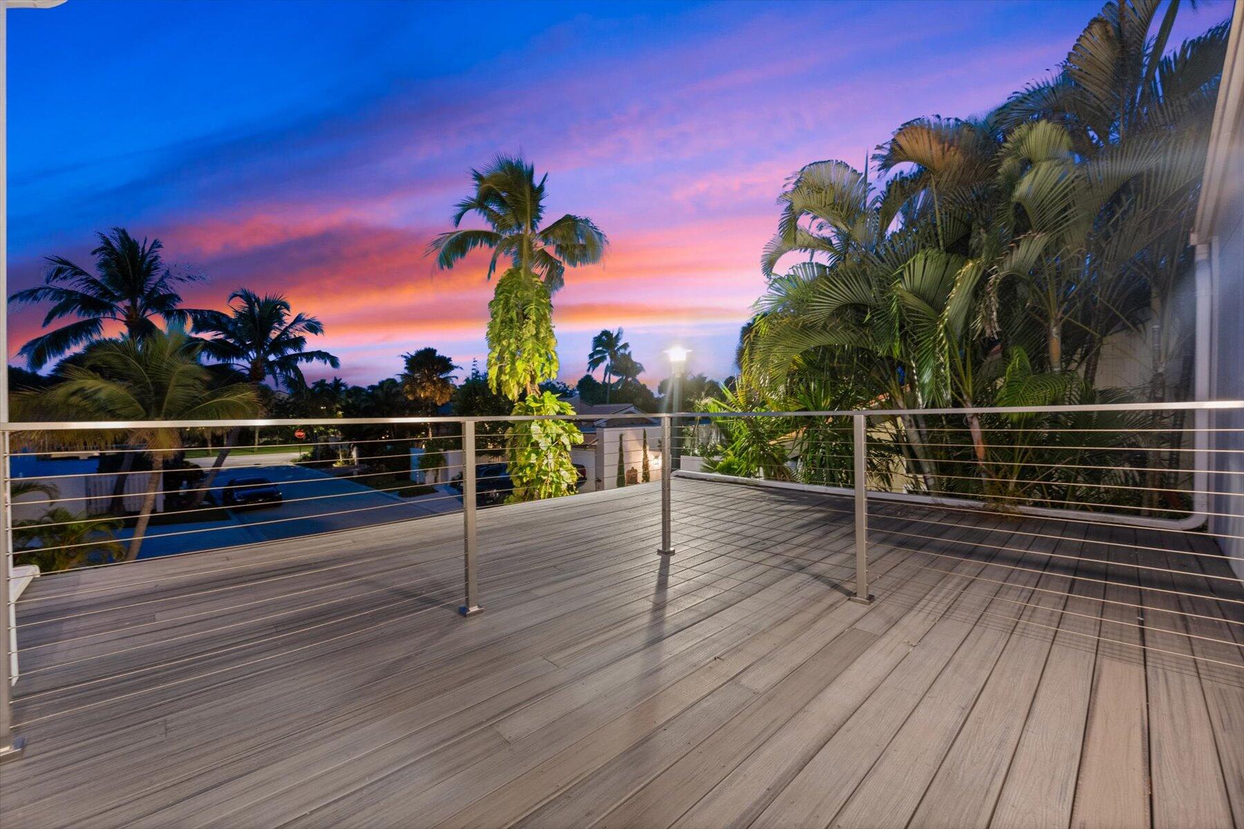 104 Sunfish Lane Jupiter, FL 33477 - Photo 31 of 66 a view of balcony with wooden floor and potted plants