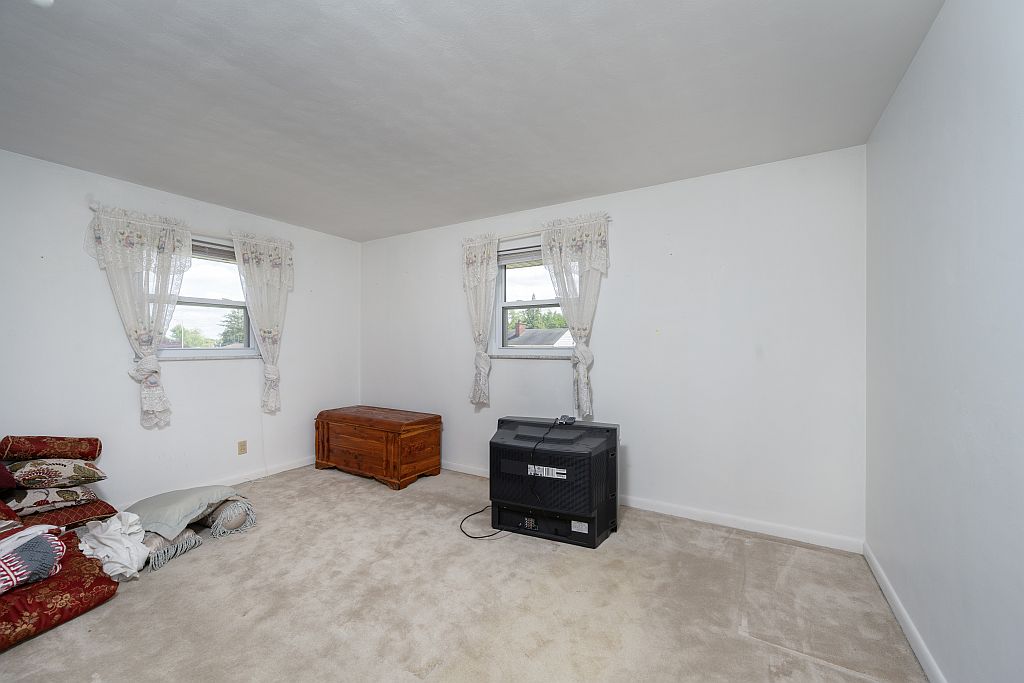 324 Beckenham Road Englewood, OH 45322 - Photo 14 of 26 This bright bedroom offers a tranquil retreat with ample natural light.