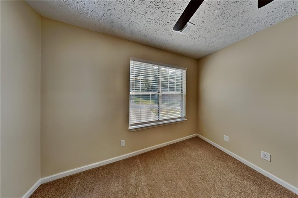 1049 Braddock Circle Woodstock, GA 30189 - Photo 13 of 20 a view of an empty room with a window