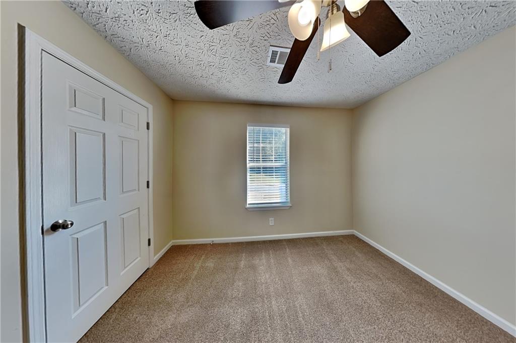 1049 Braddock Circle Woodstock, GA 30189 - Photo 15 of 20 an empty room with windows